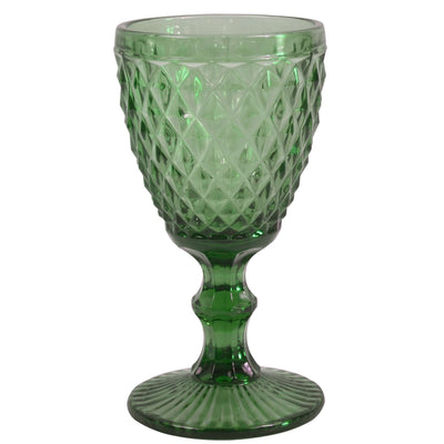 Grünes DIAMOND Weinglas von Médard de Noblat, elegantes Trinkglas für Wein auf einem Tisch.
