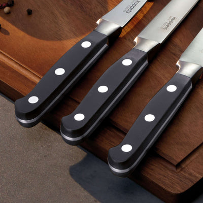 Robustes Kuppels SOLID Kochmesser aus Edelstahl, scharfe Klinge für präzises Schneiden in der Küche.