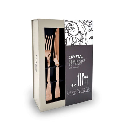 30-teiliges CRYSTAL Besteckset von Kuppels Home mit PVD-rosé-Finish, zeigt Besteckteile im eleganten Verpackungsdesign.