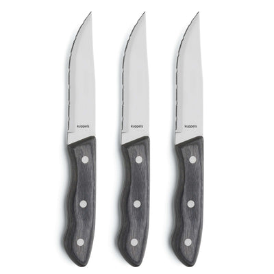 Drei schwarze Steakmesser im Kuppels Messer-Set, hochwertiges Besteck für sauberes Schneiden von Fleisch.