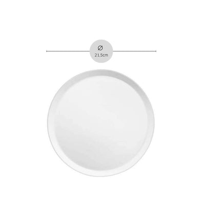 Weiße Dessertteller von Médard de Noblat aus der YAKA White Serie, elegant und schlicht für feines Tischgedeck